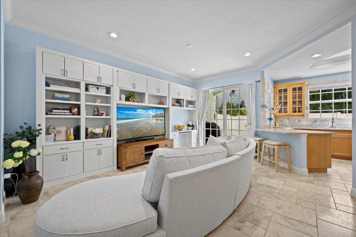 455 Ocean Ridge Way Juno Beach, FL 33408 - Photo 5 of 45 a living room with furniture and a flat screen tv