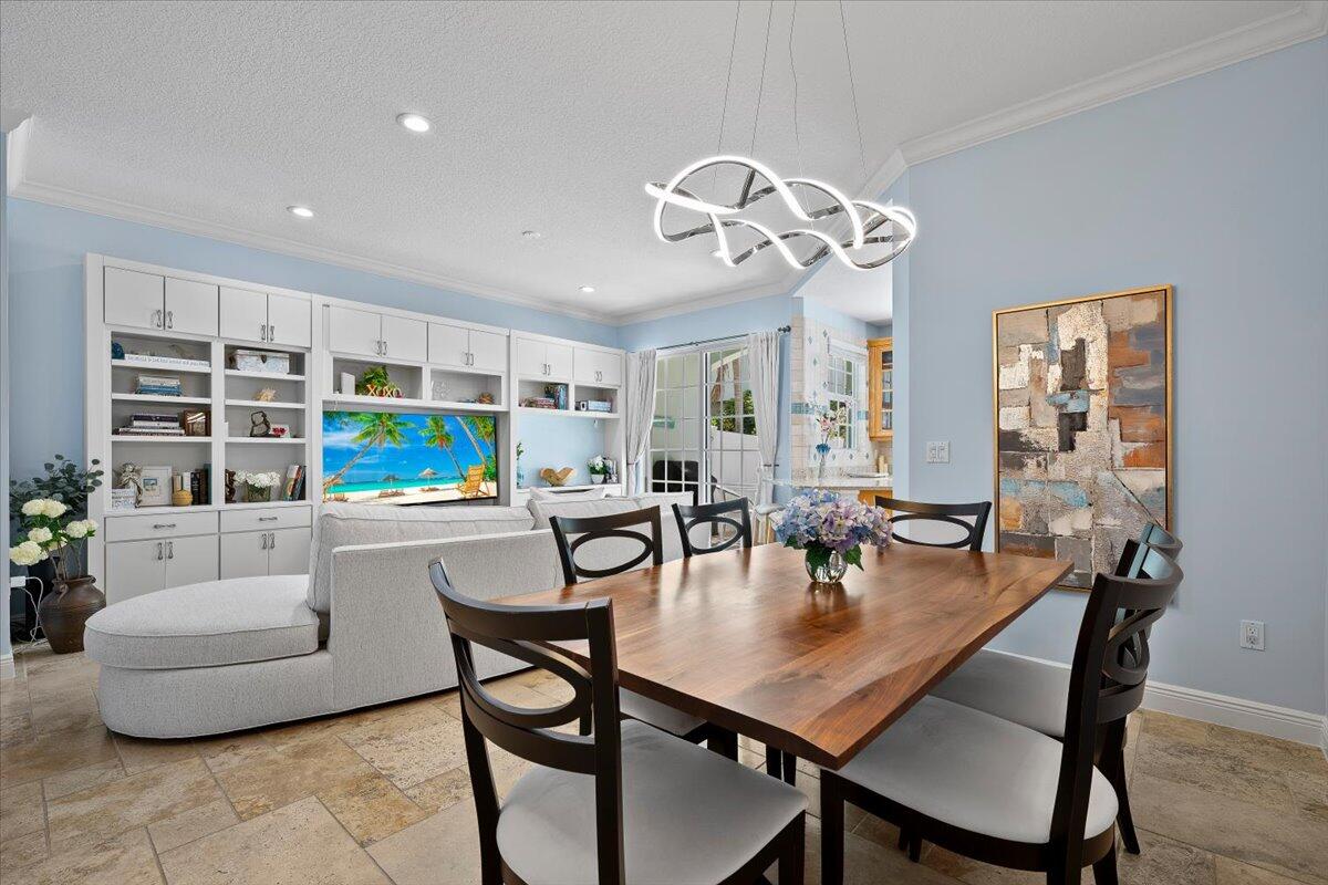 455 Ocean Ridge Way Juno Beach, FL 33408 - Photo 8 of 45 a view of a dining room with furniture and wooden floor