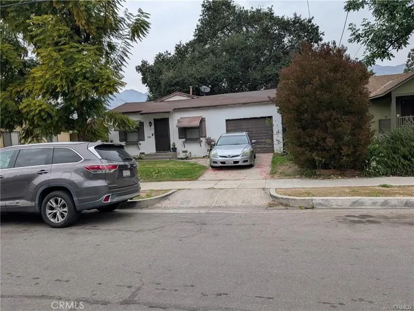 a car parked in front of a house