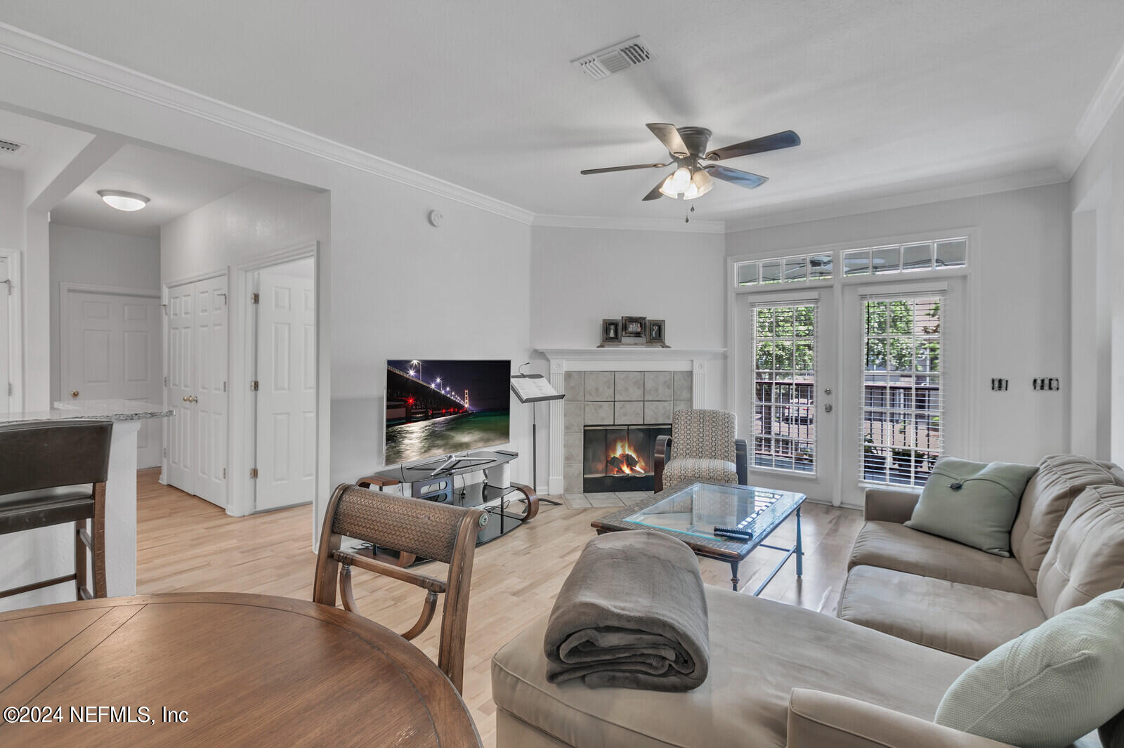 10901 Burnt Mill Road, Unit 2106 Jacksonville, FL 32256 - Photo 1 of 23 a living room with furniture and a fireplace