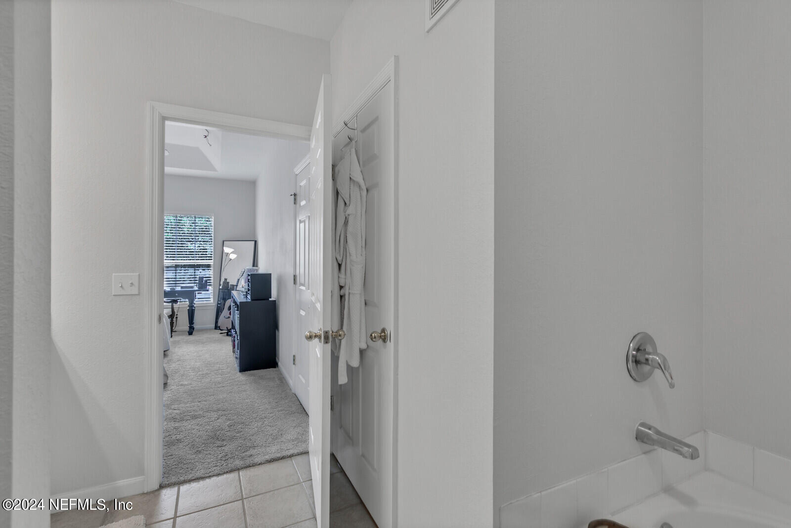 10901 Burnt Mill Road, Unit 2106 Jacksonville, FL 32256 - Photo 11 of 23 a view of a hallway with living room and dining room view