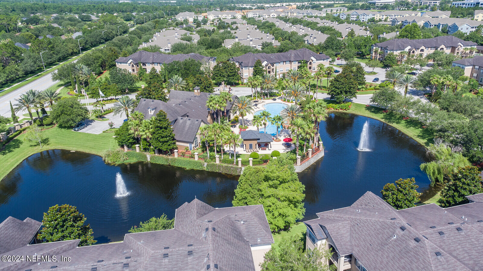 10901 Burnt Mill Road, Unit 2106 Jacksonville, FL 32256 - Photo 19 of 23 an aerial view of a house with a garden and lake view