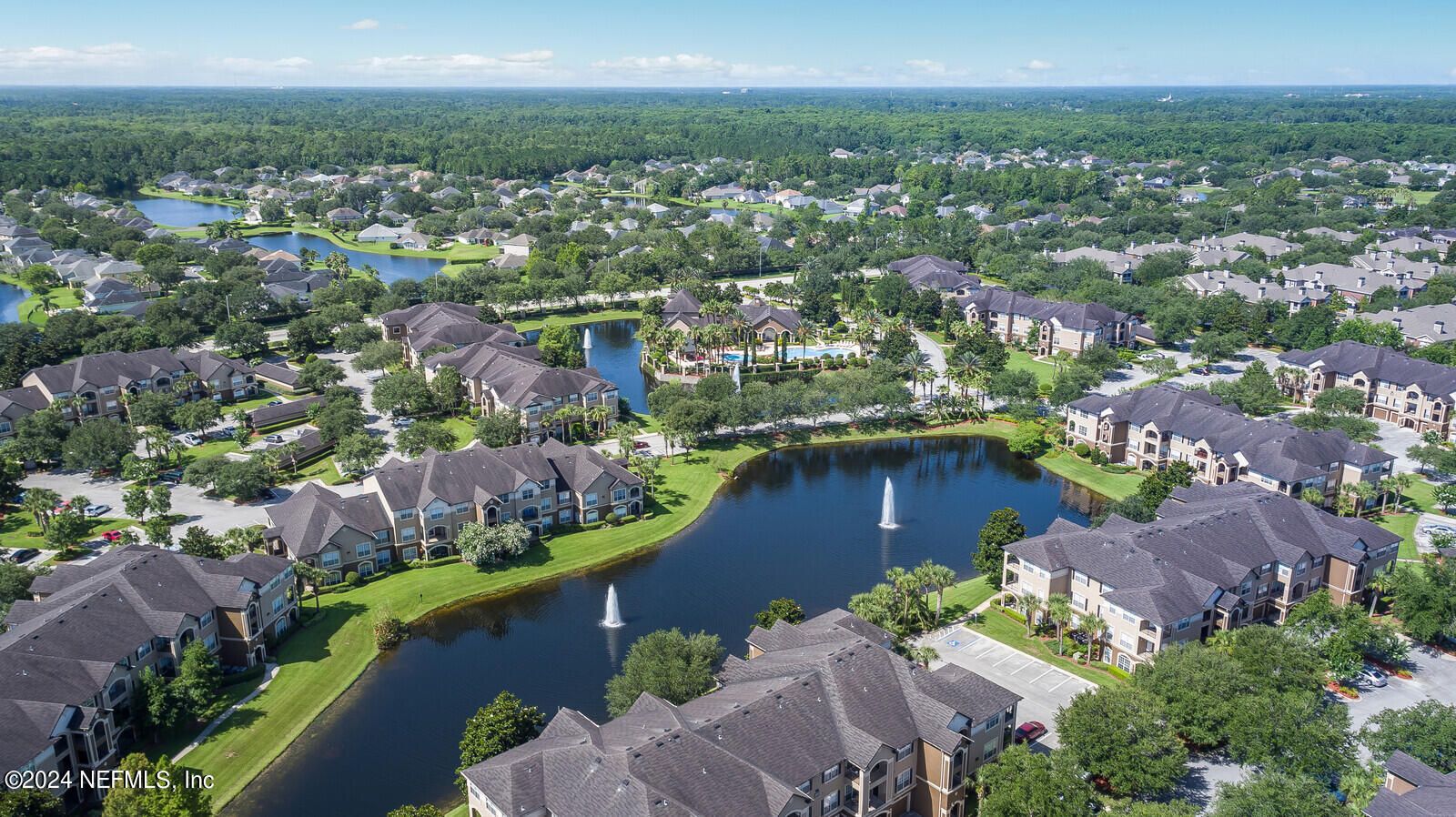 10901 Burnt Mill Road, Unit 2106 Jacksonville, FL 32256 - Photo 21 of 23 an aerial view of residential houses with outdoor space