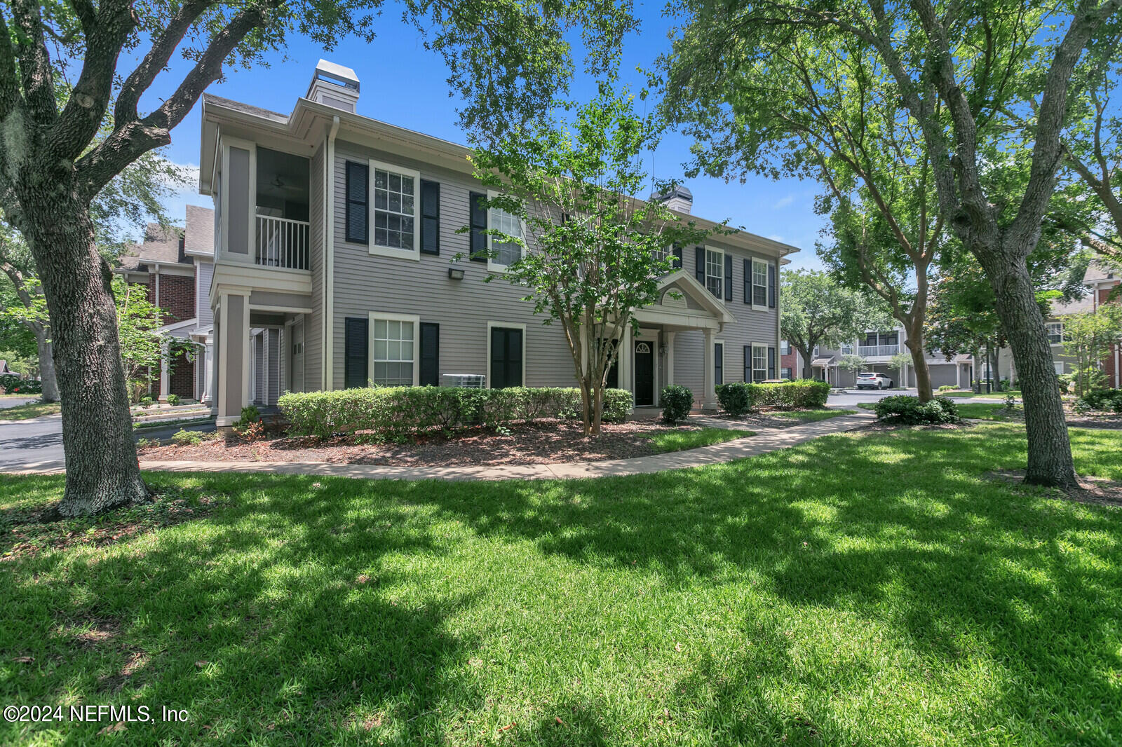 10901 Burnt Mill Road, Unit 2106 Jacksonville, FL 32256 - Photo 3 of 23 a view of a house with a yard porch and sitting area