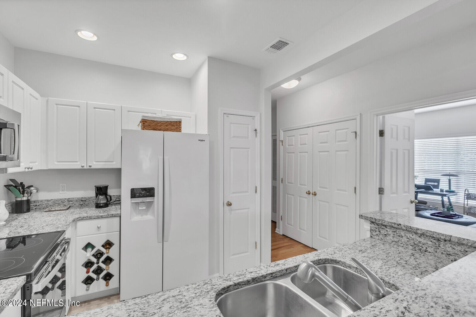10901 Burnt Mill Road, Unit 2106 Jacksonville, FL 32256 - Photo 8 of 23 a kitchen with stainless steel appliances granite countertop a refrigerator and a sink