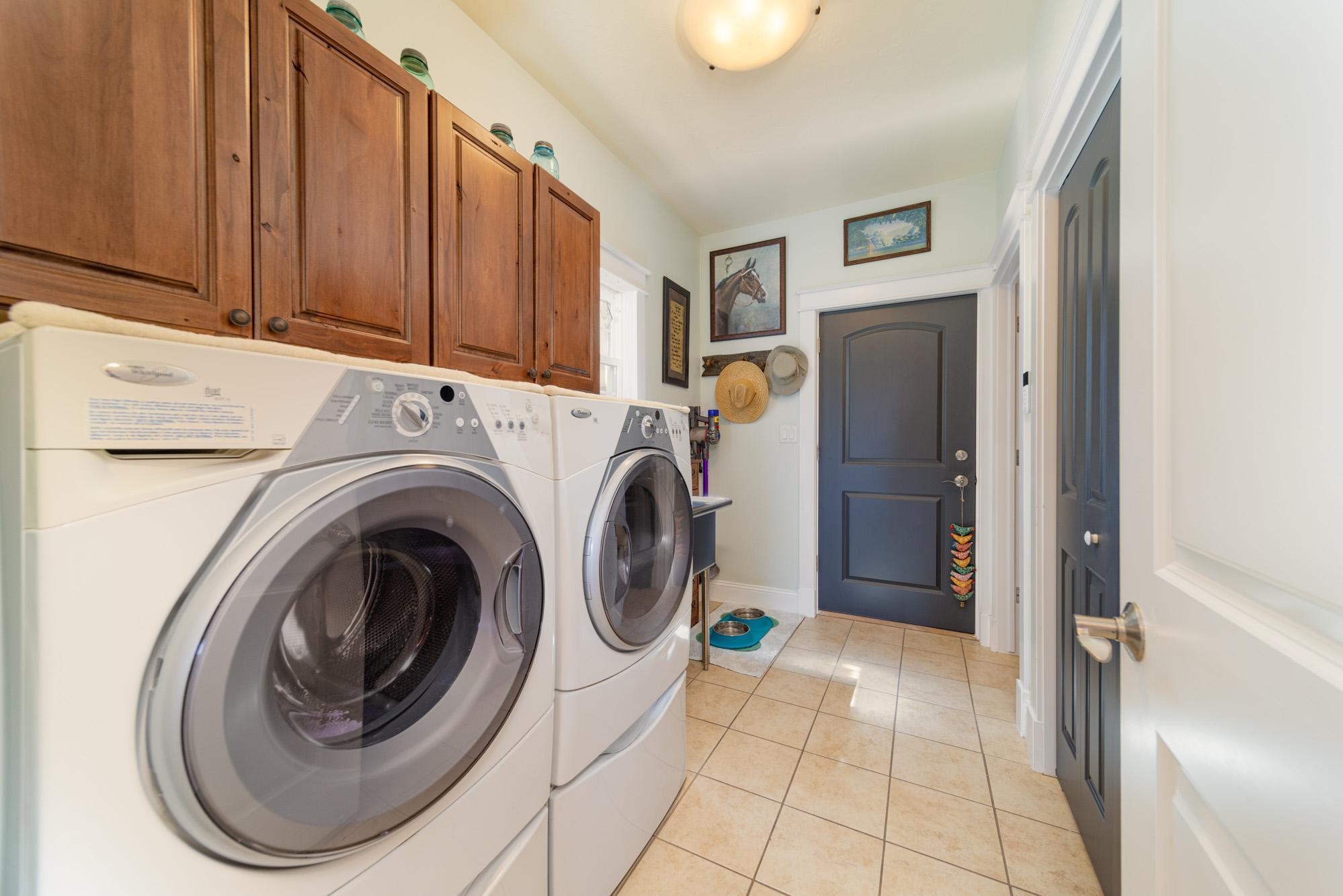 1371 Saddle Ridge Road Loma, CO 81524 - Photo 16 of 42 a view of a hallway with washer and dryer