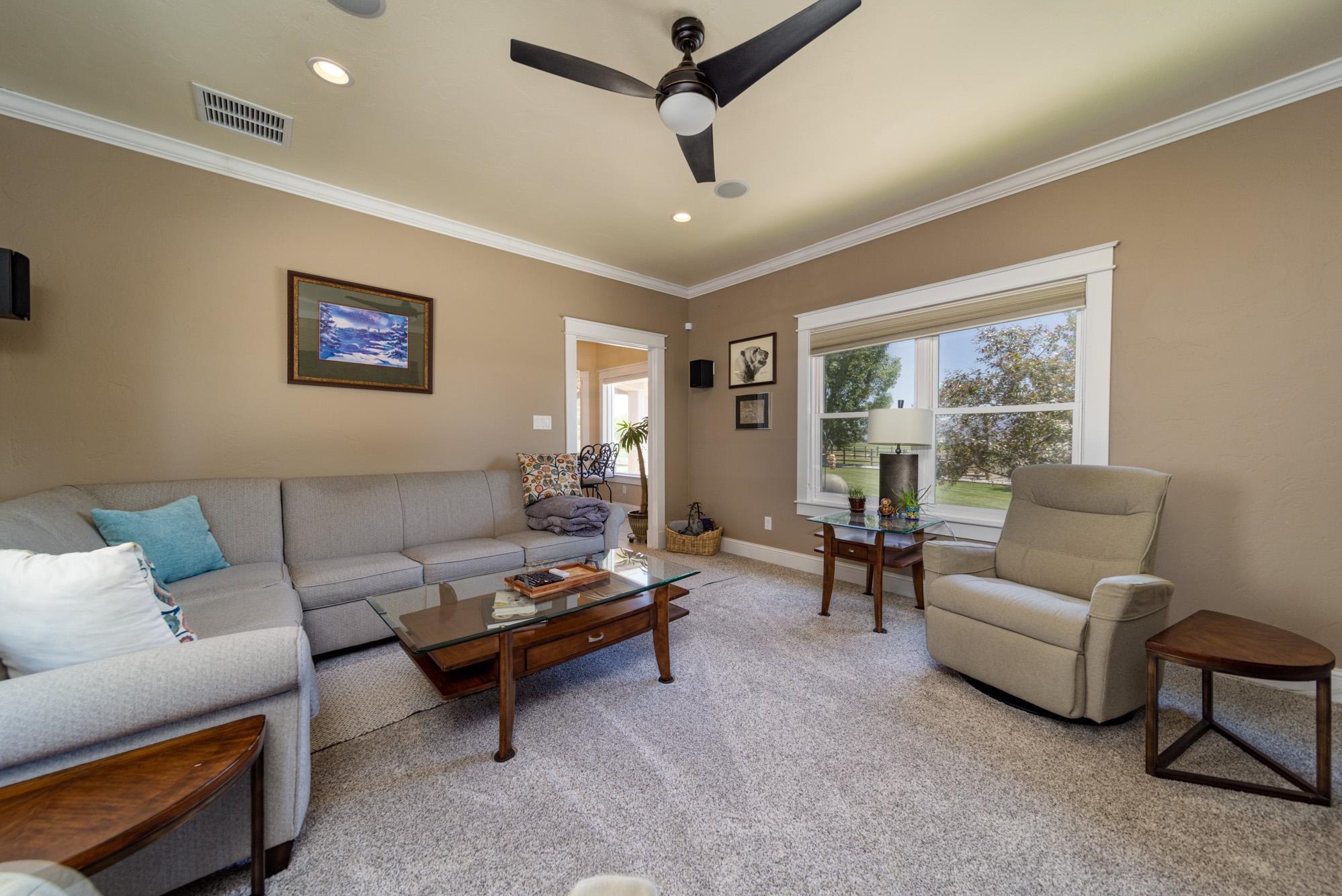 1371 Saddle Ridge Road Loma, CO 81524 - Photo 18 of 42 a living room with furniture and a window