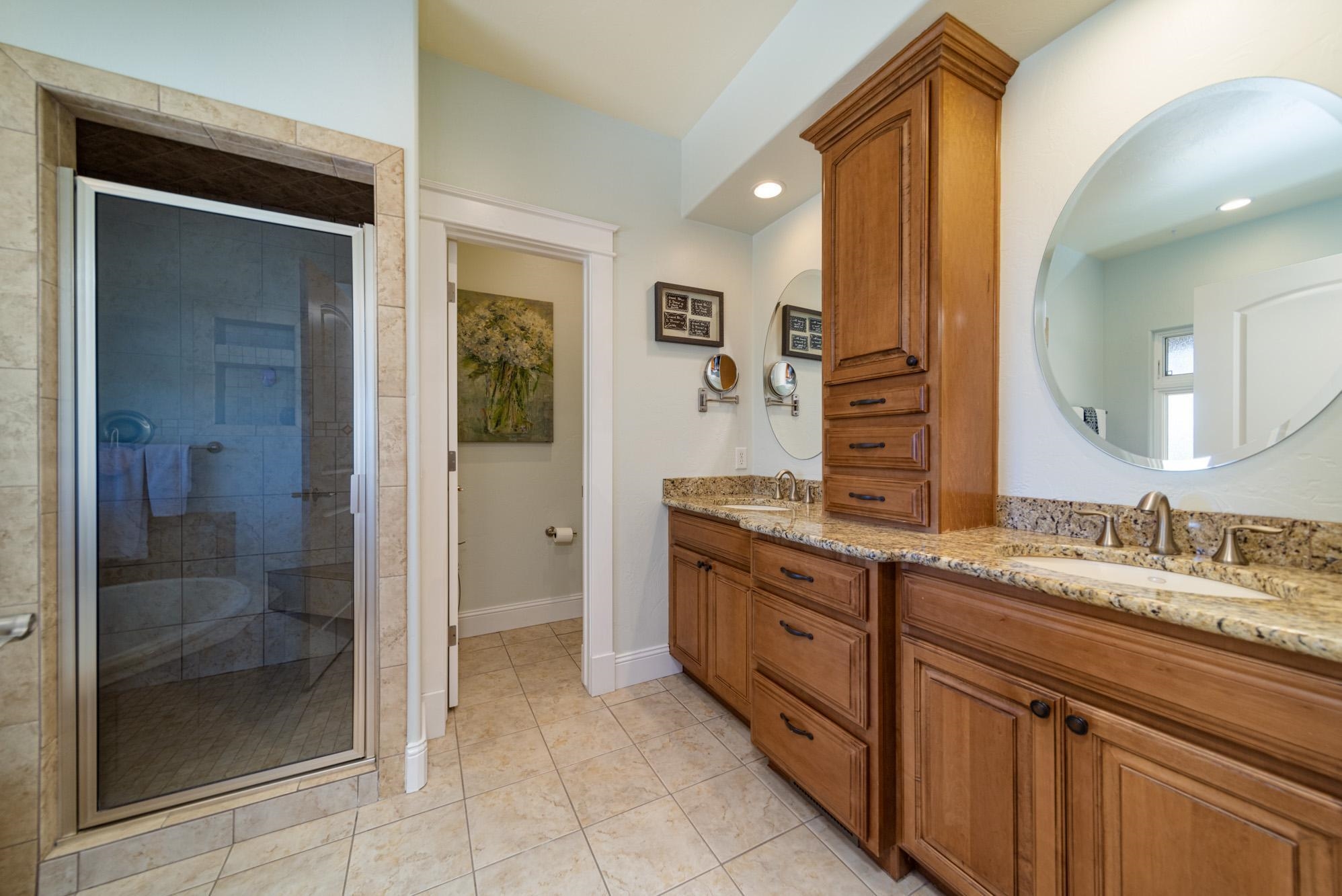 1371 Saddle Ridge Road Loma, CO 81524 - Photo 21 of 42 a spacious bathroom with a granite countertop sink mirror and shower