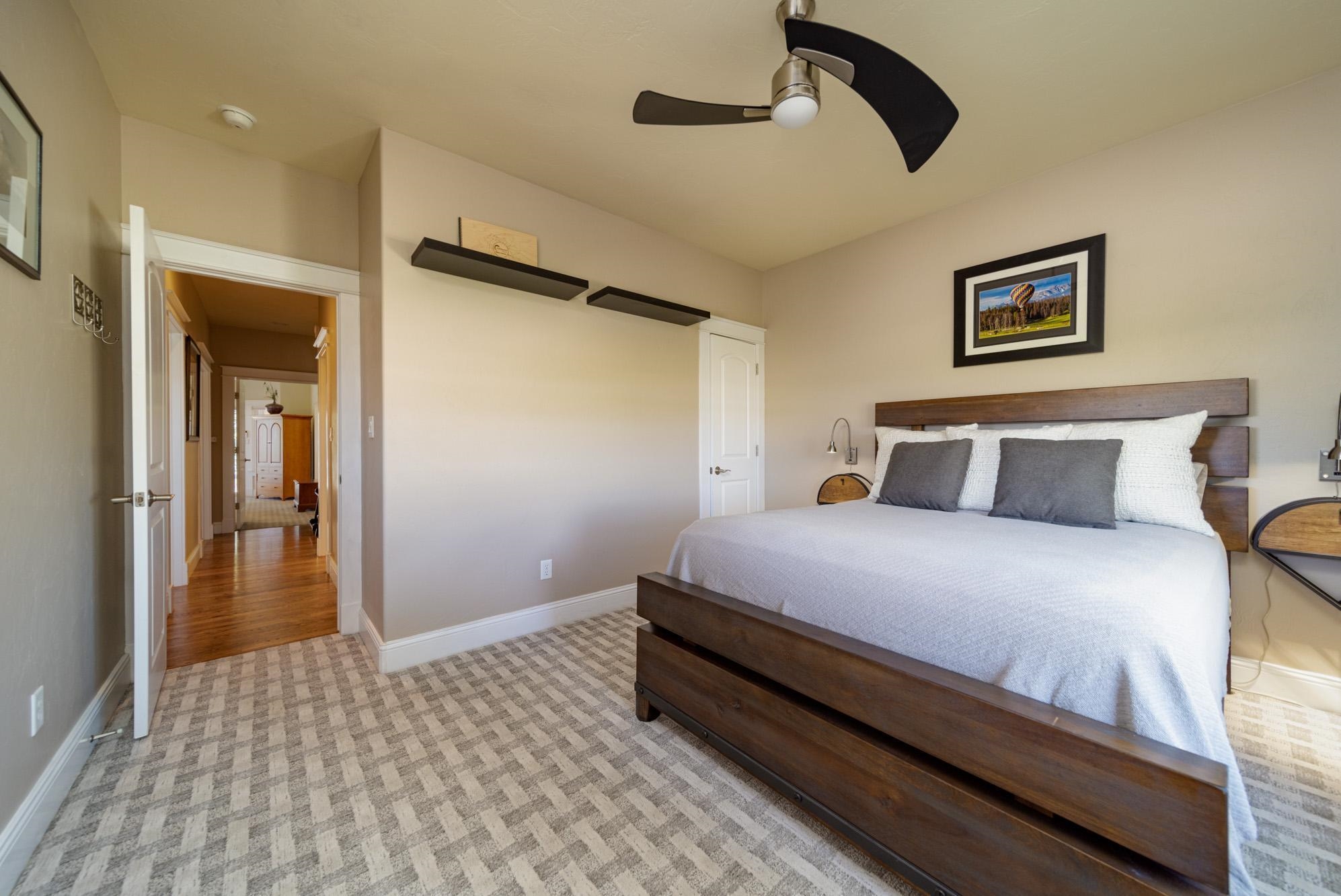 1371 Saddle Ridge Road Loma, CO 81524 - Photo 24 of 42 a bedroom with a bed and a walk in closet