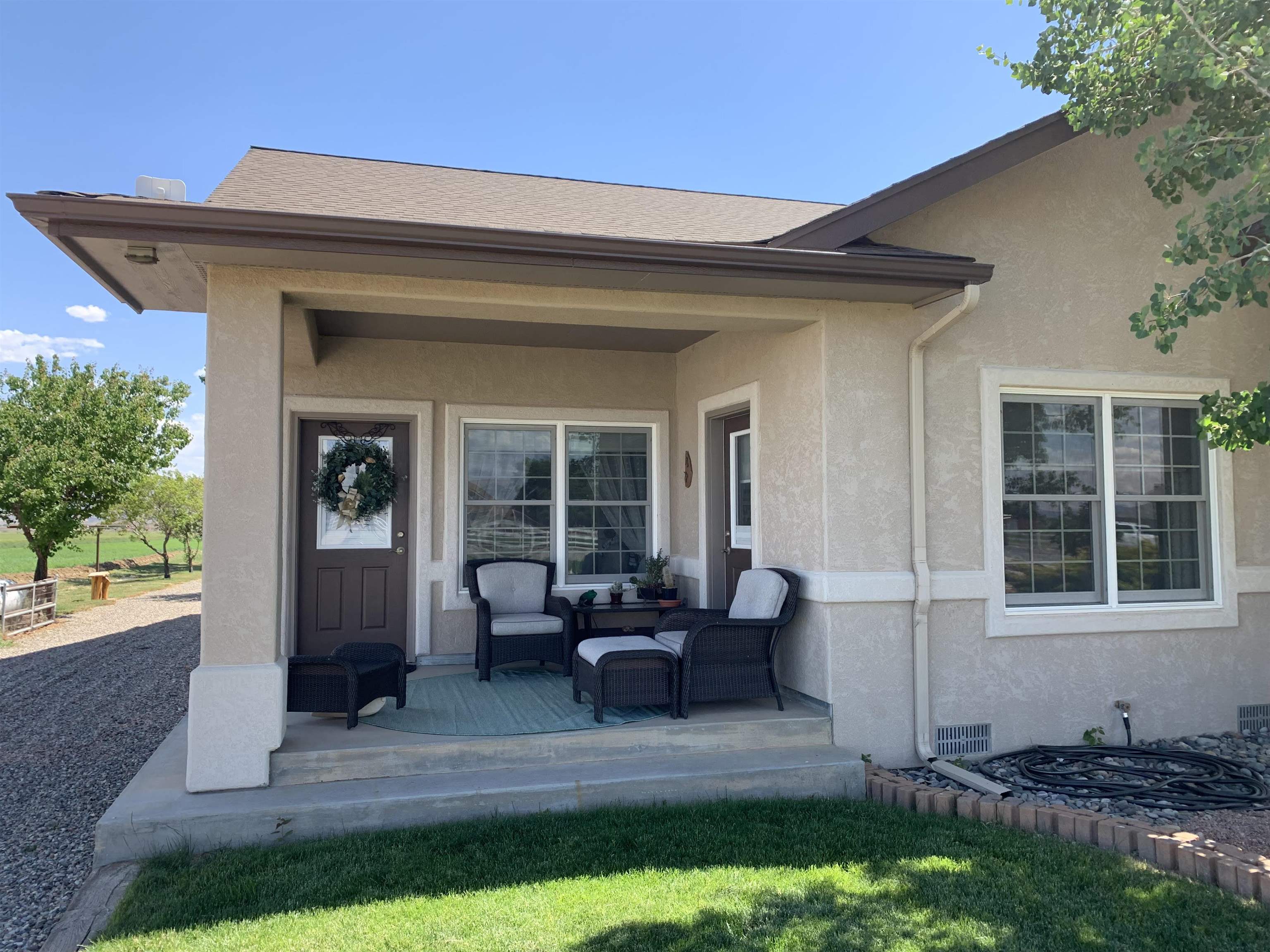 1371 Saddle Ridge Road Loma, CO 81524 - Photo 28 of 42 a view of house and patio with a yard