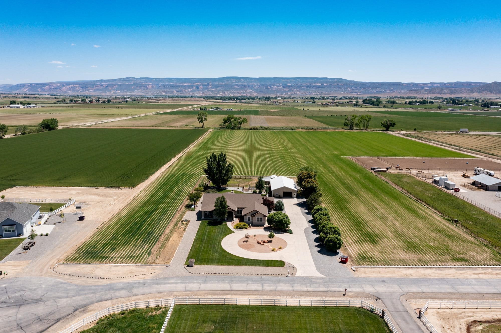 1371 Saddle Ridge Road Loma, CO 81524 - Photo 4 of 42 a view of a swimming pool and an ocean view