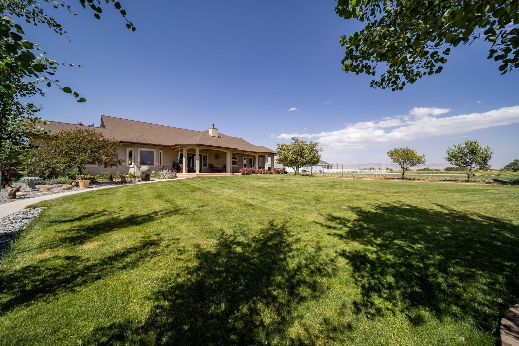 1371 Saddle Ridge Road Loma, CO 81524 - Photo 42 of 42 a view of a house with a big yard