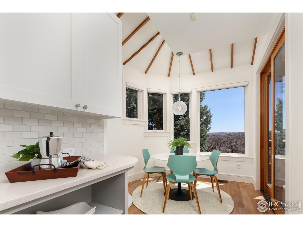 2088 Alpine Dr. Boulder, CO 80304 - Photo 11 of 37 a view of a dining room with furniture window and outside view