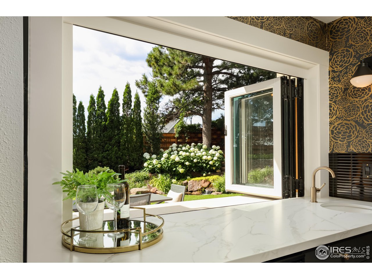 2088 Alpine Dr. Boulder, CO 80304 - Photo 27 of 37 a view of a living room with a floor to ceiling window and potted plants