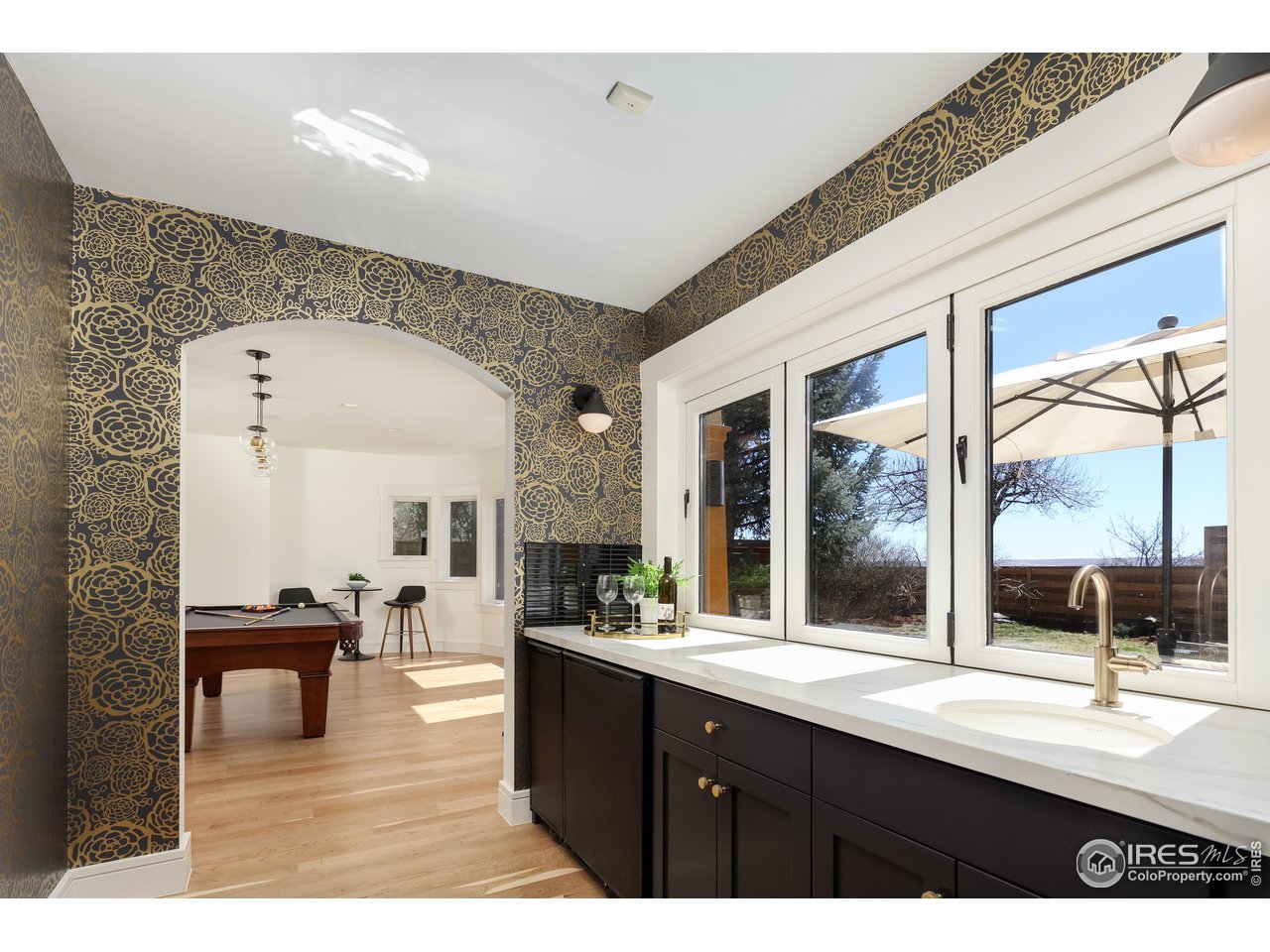 2088 Alpine Dr. Boulder, CO 80304 - Photo 28 of 37 a living room with stainless steel appliances kitchen island granite countertop a sink and cabinets