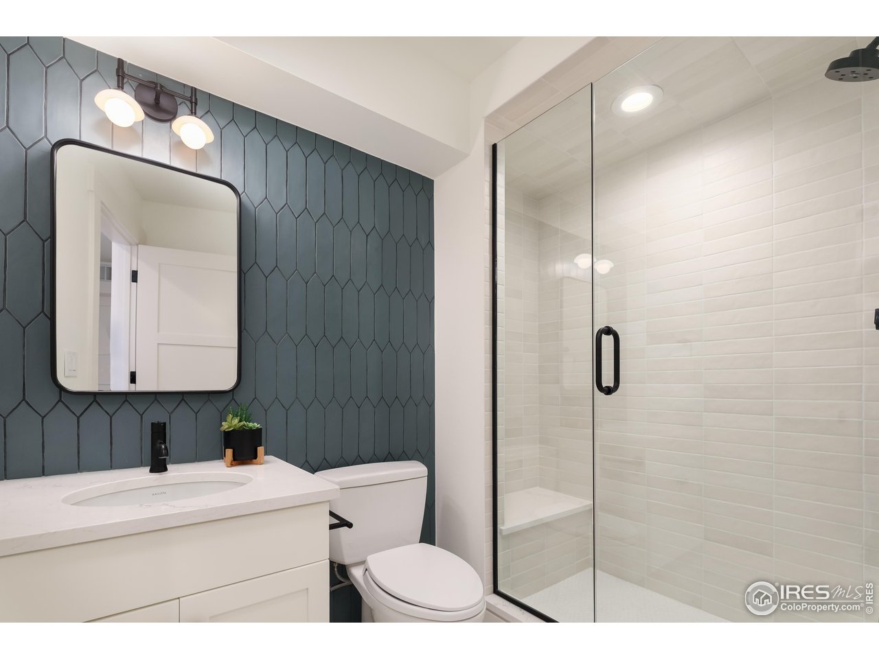 2088 Alpine Dr. Boulder, CO 80304 - Photo 32 of 37 a bathroom with a sink a toilet and shower