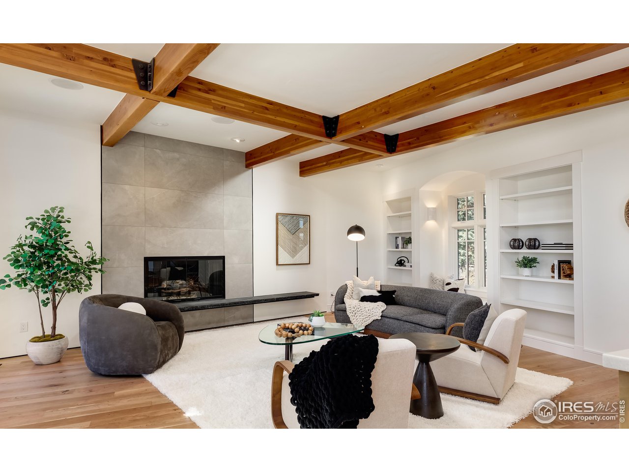 2088 Alpine Dr. Boulder, CO 80304 - Photo 4 of 37 a living room with furniture potted plant and a fireplace