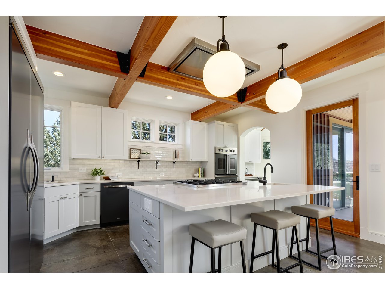 2088 Alpine Dr. Boulder, CO 80304 - Photo 7 of 37 a kitchen with a sink cabinets and stainless steel appliances