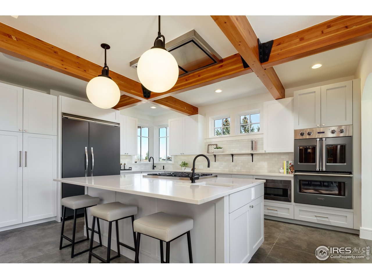 2088 Alpine Dr. Boulder, CO 80304 - Photo 8 of 37 a kitchen with a sink cabinets and stainless steel appliances