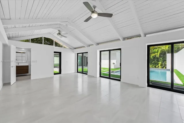 a bathroom with a shower sink and mirror