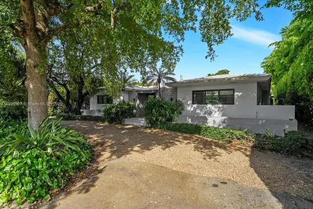 front view of a house with a small garden