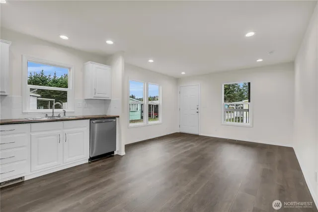 a view of a kitchen with a sink and a window
