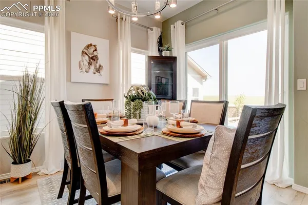 a view of a dining room with furniture window and outside view
