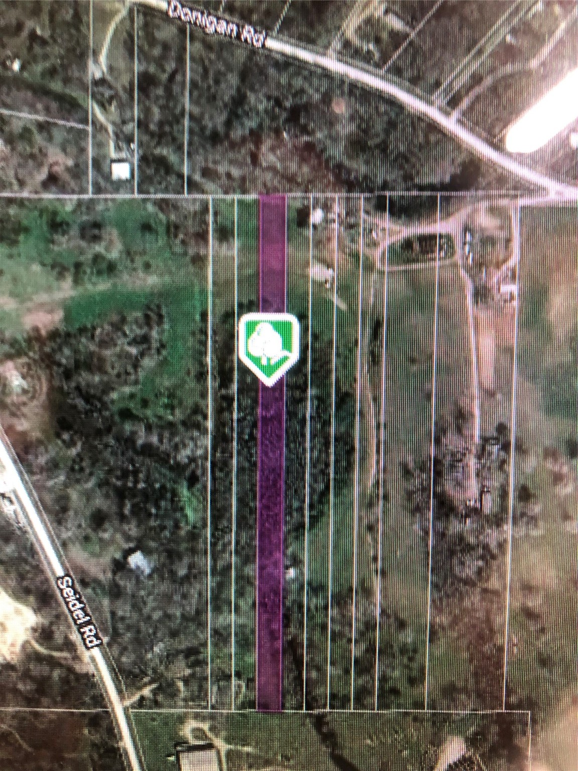 0 Donigan Road Brookshire, TX 77423 - Photo 2 of 6 a view of a glass door and a tree