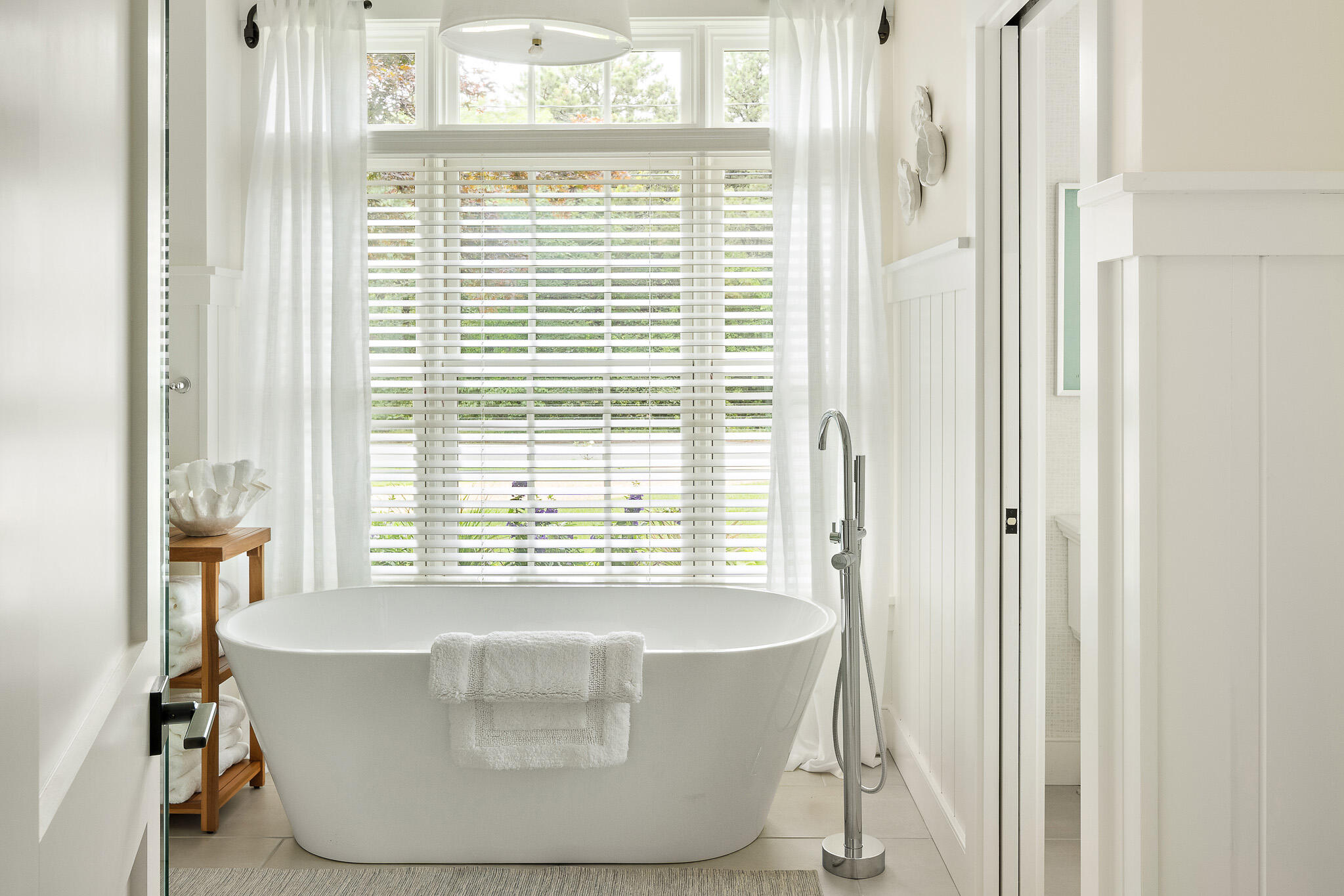 36 Crocker Drive Edgartown, MA 02539 - Photo 31 of 48 a white bath tub sitting in a bathroom next to a window