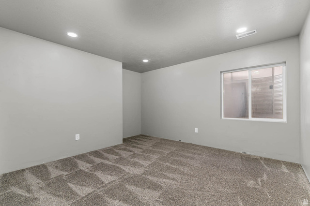 5686 Duke Lane Tooele, UT 84074 - Photo 36 of 38 Carpeted empty room featuring recessed lighting