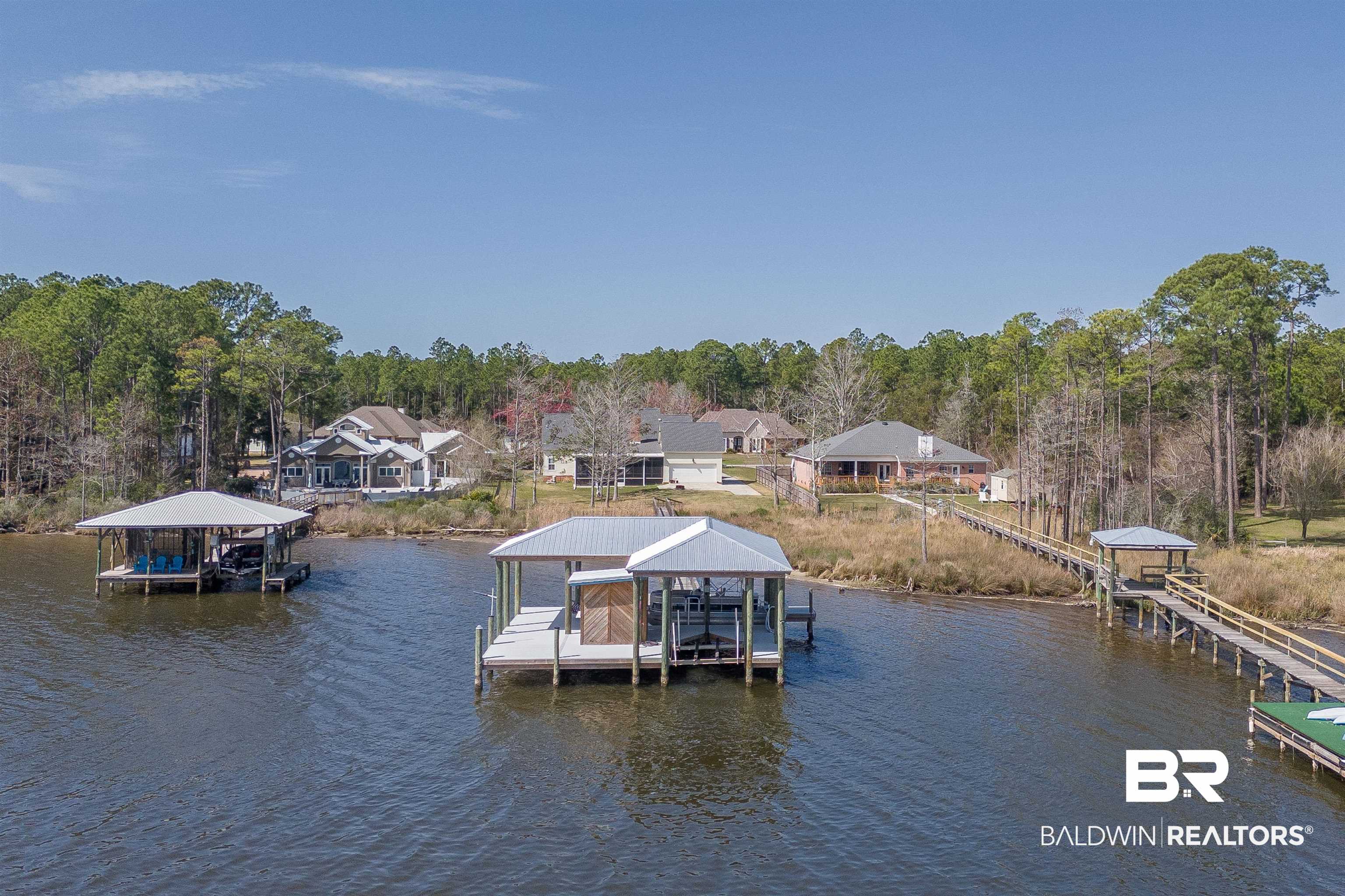 8915 Bay Point Drive Elberta, AL 36530 - Photo 28 of 74 Dock area featuring a water view and boat lift