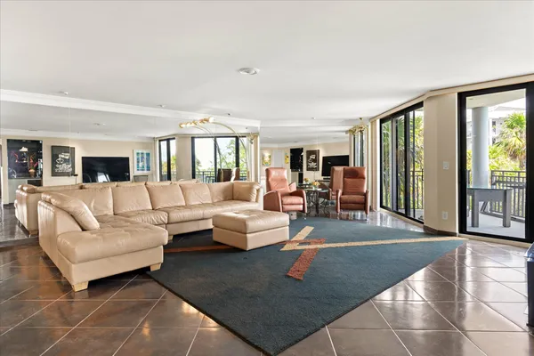 a kitchen with a sink and a stove next to a window