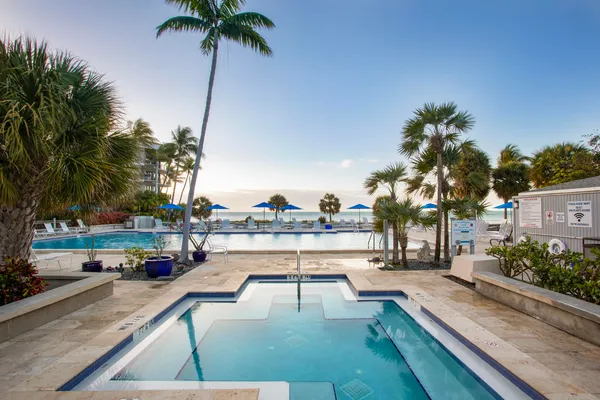 a kitchen with granite countertop a sink and cabinets