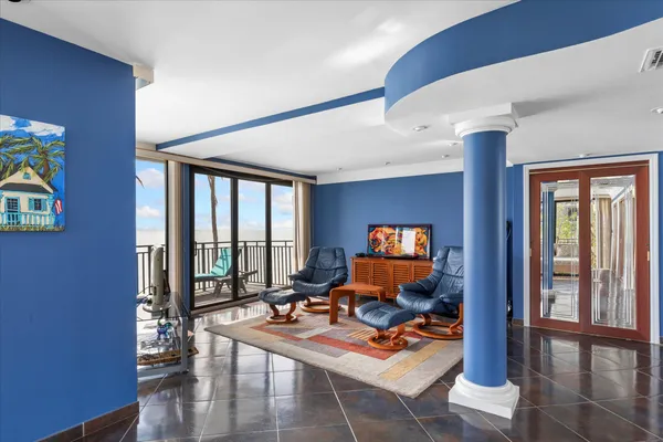 a view of swimming pool with outdoor seating and lake view