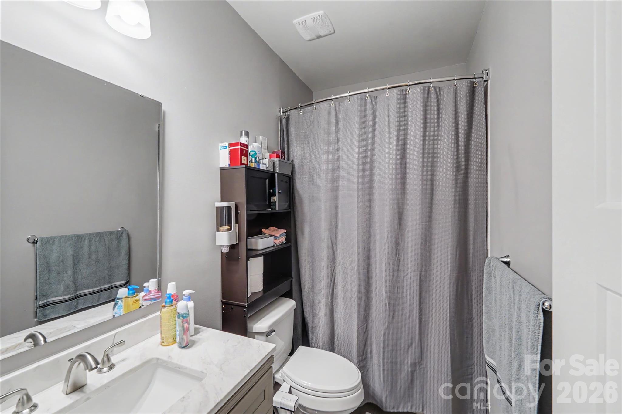 119 Brown Street Clover, SC 29710 - Photo 10 of 24 a bathroom with a sink vanity mirror and toilet