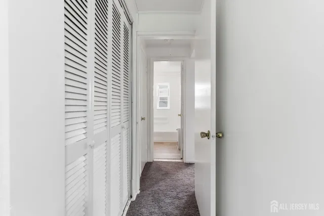 a view of a bathroom from a hallway