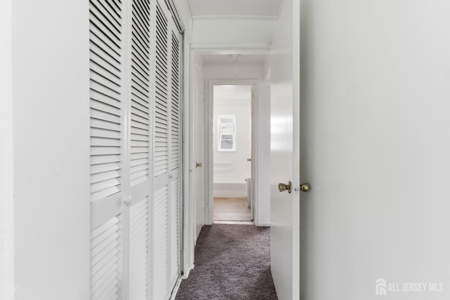 37B Garfield Park, Unit B Edison, NJ 08837 - Photo 14 of 18 a view of a bathroom from a hallway