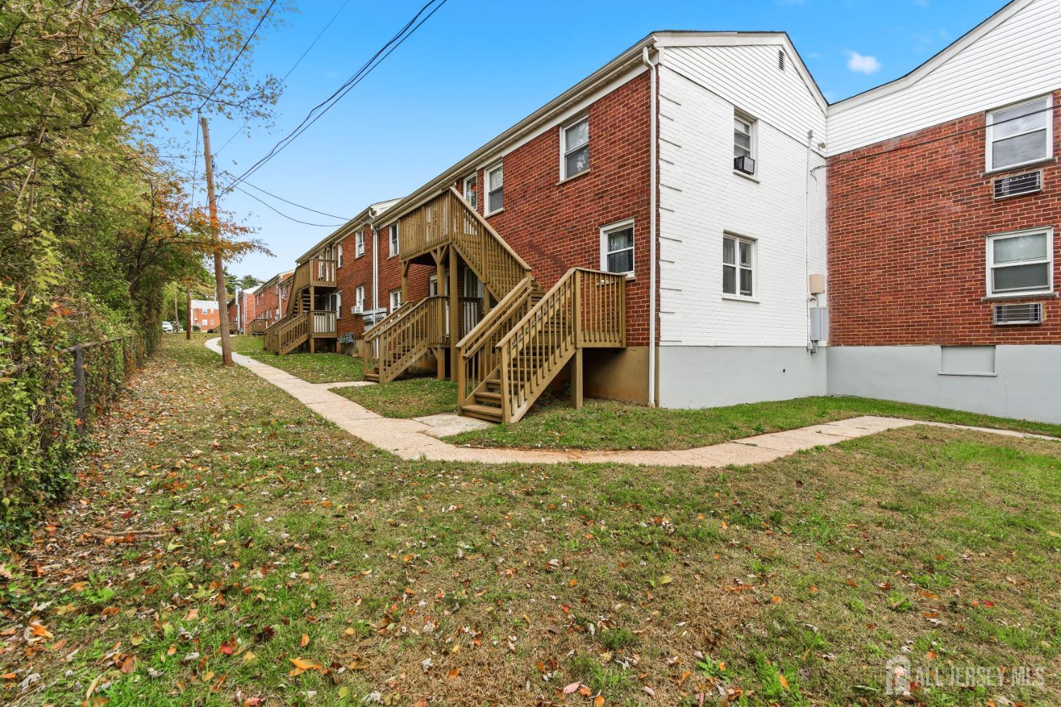37B Garfield Park, Unit B Edison, NJ 08837 - Photo 17 of 18 a view of a house with a yard