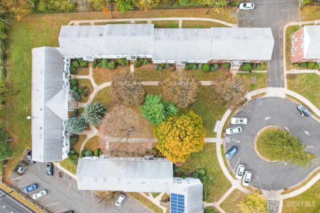 an aerial view of a house with a swimming pool