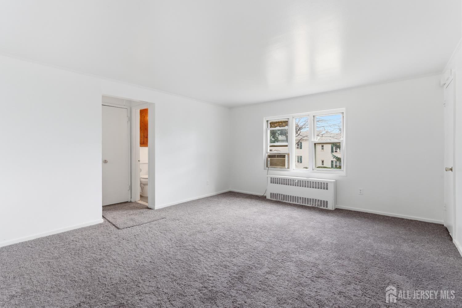 37B Garfield Park, Unit B Edison, NJ 08837 - Photo 5 of 18 an empty room with windows