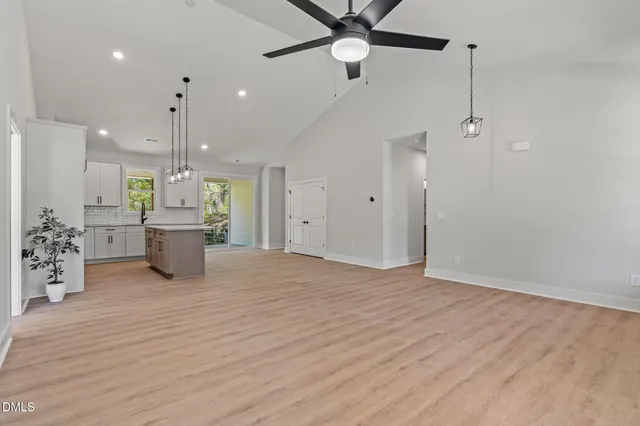 a view of a kitchen with a dishwasher and a refrigerator