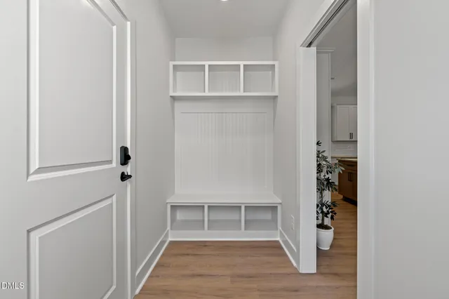 a view of an entryway with wooden floor