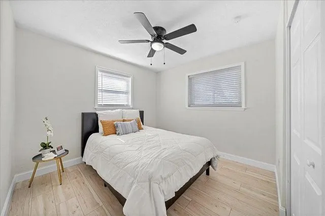 a bedroom with a bed and window