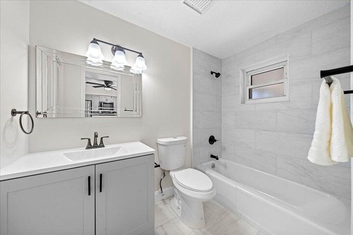 3401 Purdue Street Melbourne, FL 32901 - Photo 12 of 19 a bathroom with a sink a toilet and shower