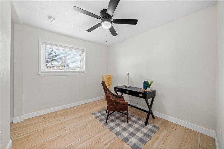 3401 Purdue Street Melbourne, FL 32901 - Photo 13 of 19 a workspace room with furniture and wooden floor