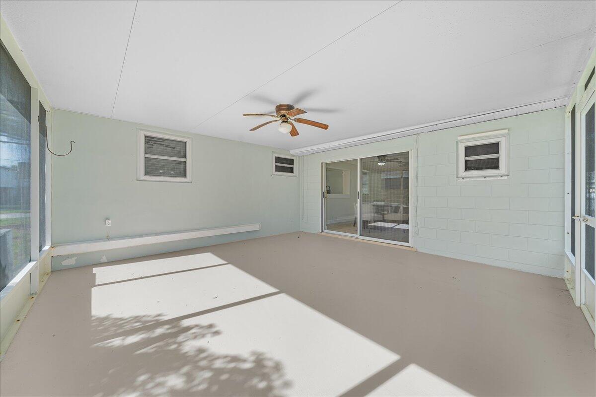 3401 Purdue Street Melbourne, FL 32901 - Photo 18 of 19 a view of a livingroom with a ceiling fan and window