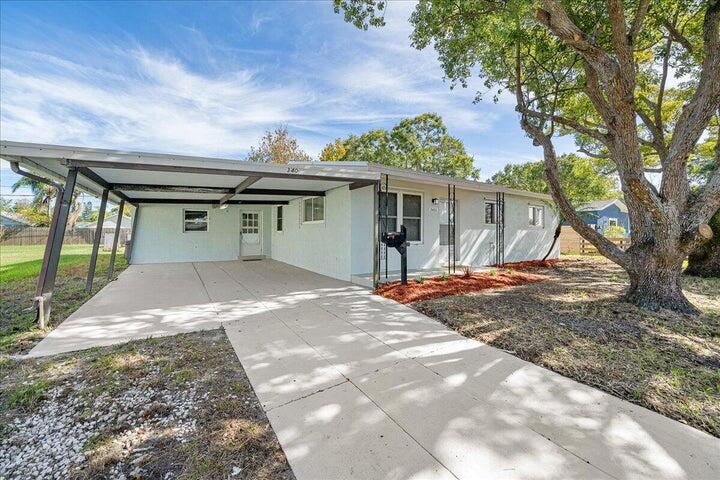 3401 Purdue Street Melbourne, FL 32901 - Photo 2 of 19 a front view of a house with a yard