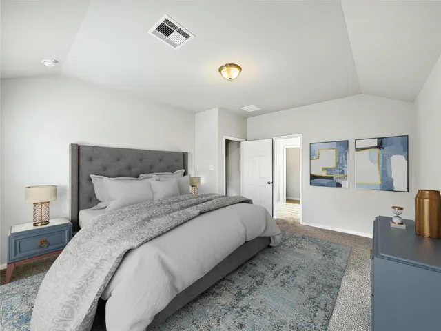 a spacious bedroom with a bed and a view of living room