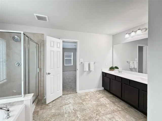 a view of a bathroom with a sink and mirror