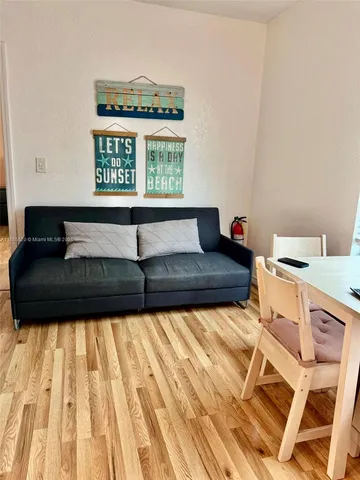 a living room with a couch and a window